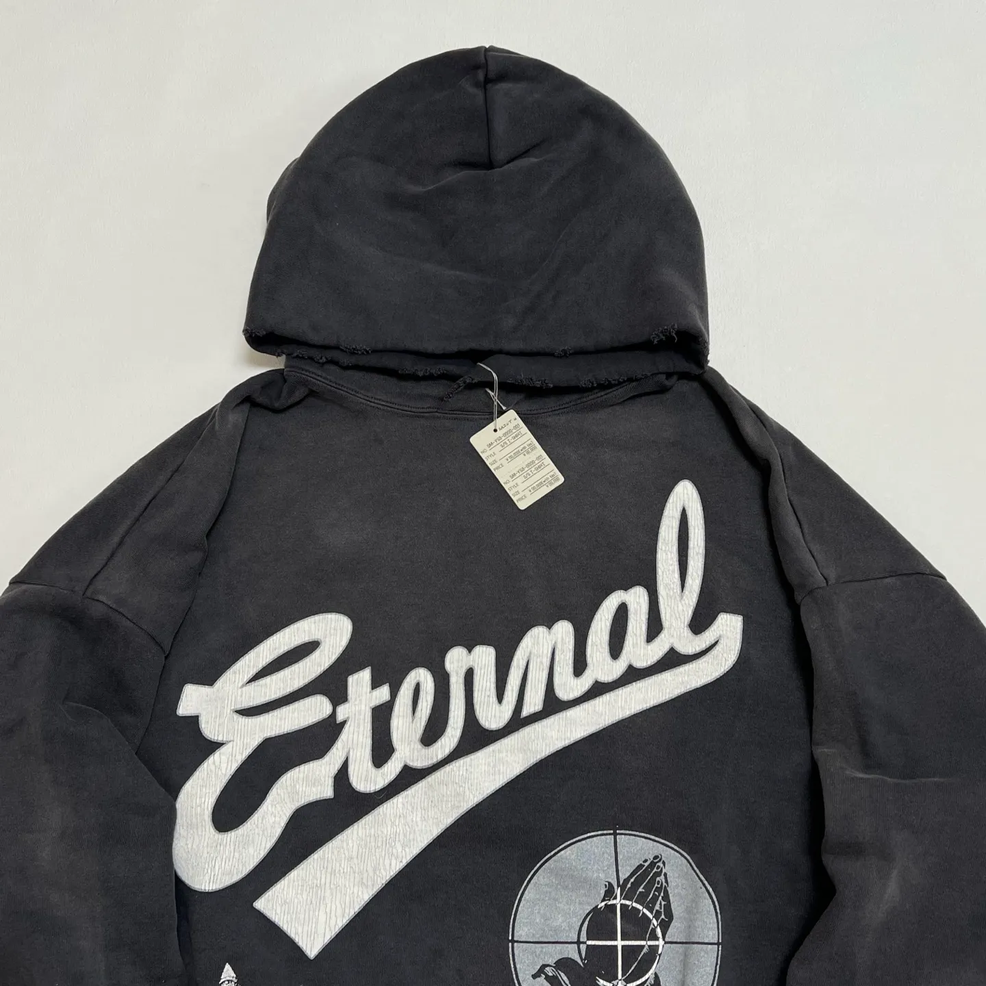 SAINT Mxxxxxx × FEAR OF GOD FG_HOODIE/SNT OF GOD/BLK FOG joint model ETERNAL praying crosshair distressed hoodie. Washed black S-XL. This season's popular super popular joint model. The original version is the same. Thin spring and summer fabrics. The upper body is comfortable. The BOXY version of the short fat wide shoulder line. Fashion darling wears it with a high-end feel. Heavy washing and water fading technology. The horse is repositioned. Excessive wear and damage graffiti treatment. Correct version FOG joint main mark/wash mark/little angel mark